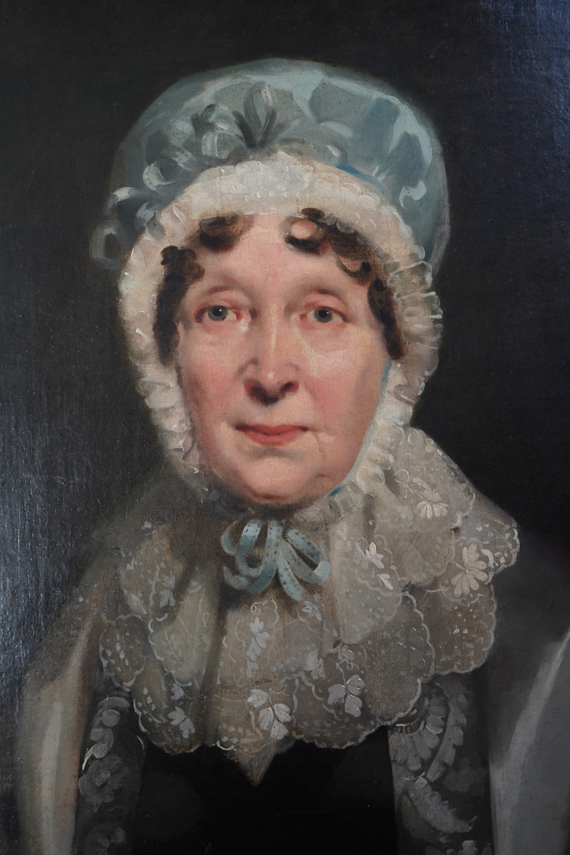 English School, 19th century, A portrait of a seated lady wearing a lace bonnet